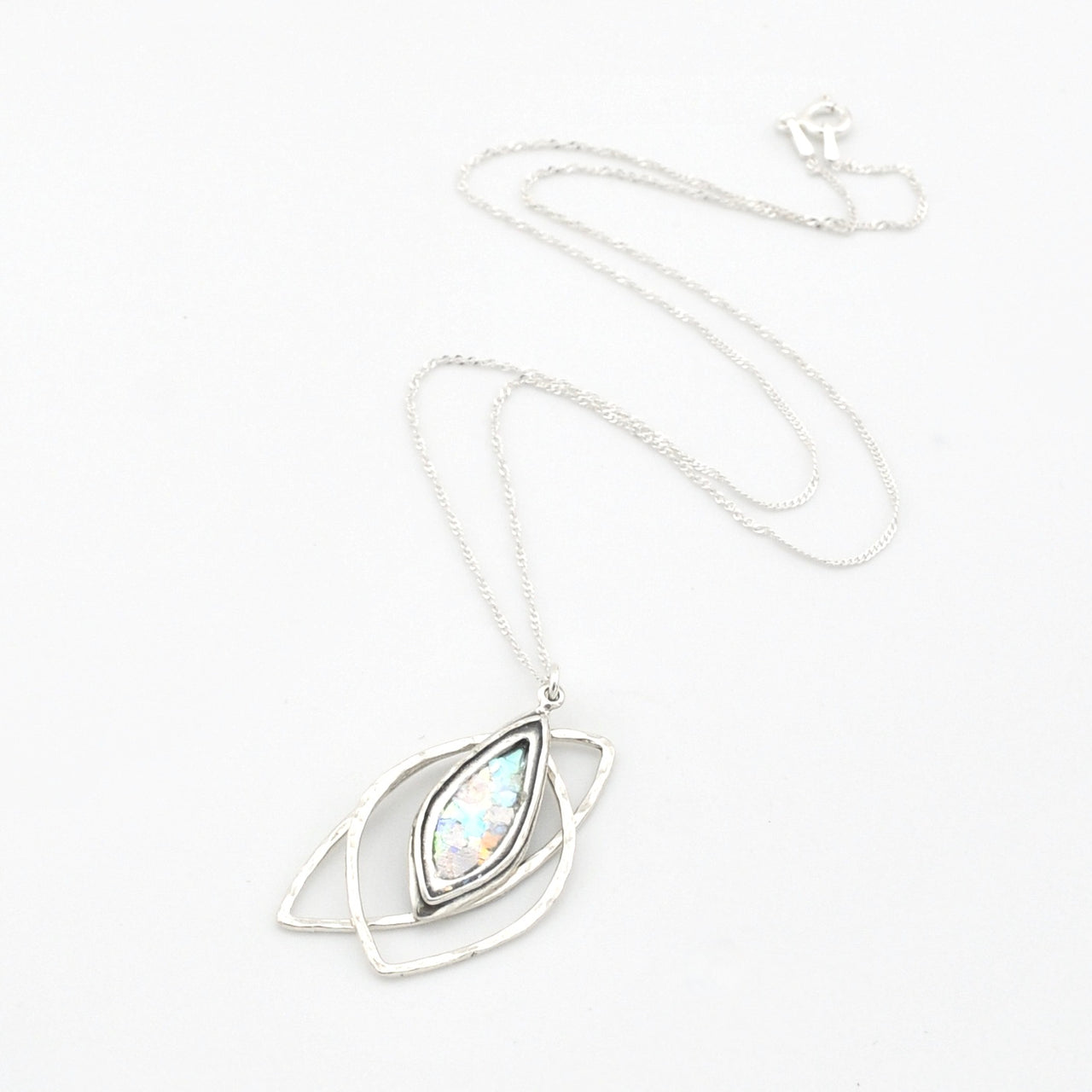Silver necklace with a pendant on a white background