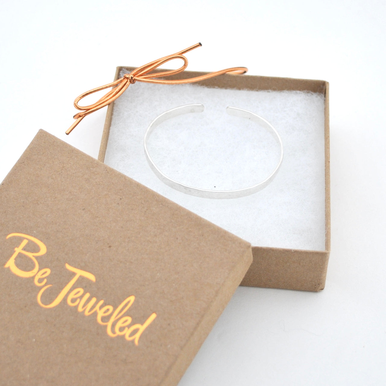 Clear bracelet in a 'Be Jeweled' box on a white background