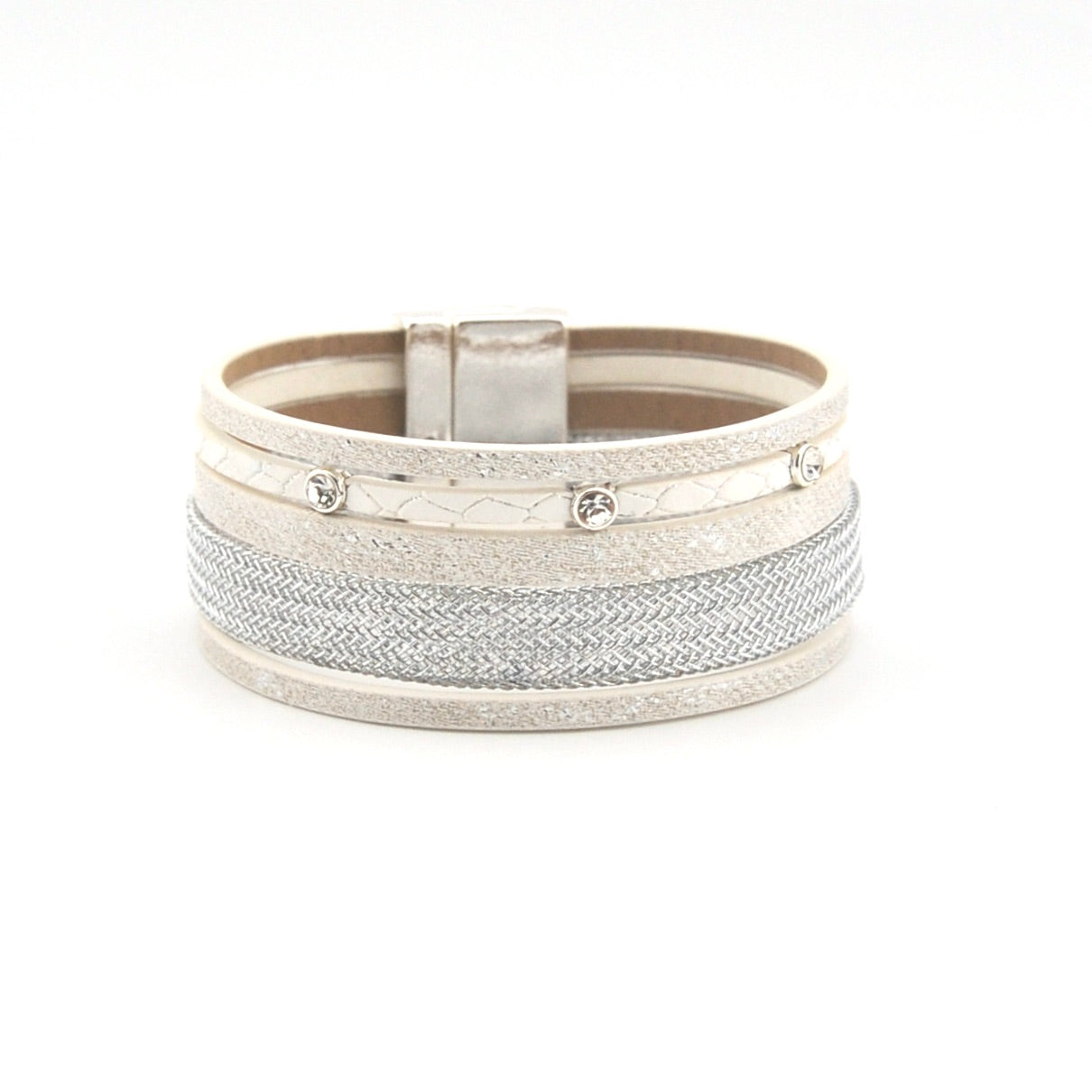 Silver bracelet with textured bands on a white background