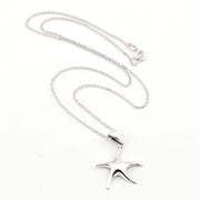 Silver starfish pendant necklace on a white background