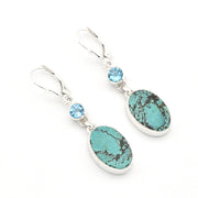 Turquoise and blue gemstone earrings on a white background