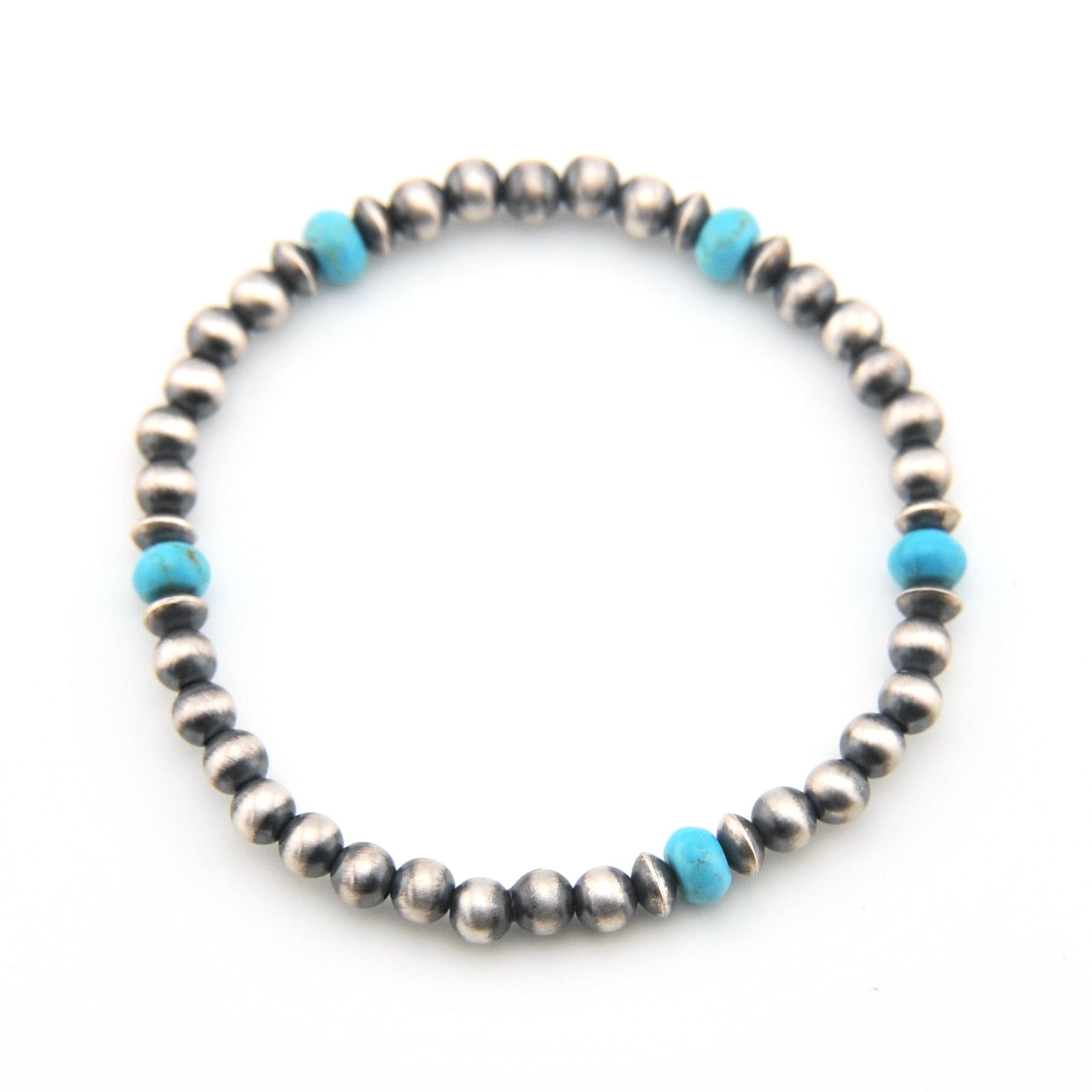 Beaded bracelet with silver and turquoise beads on a white background