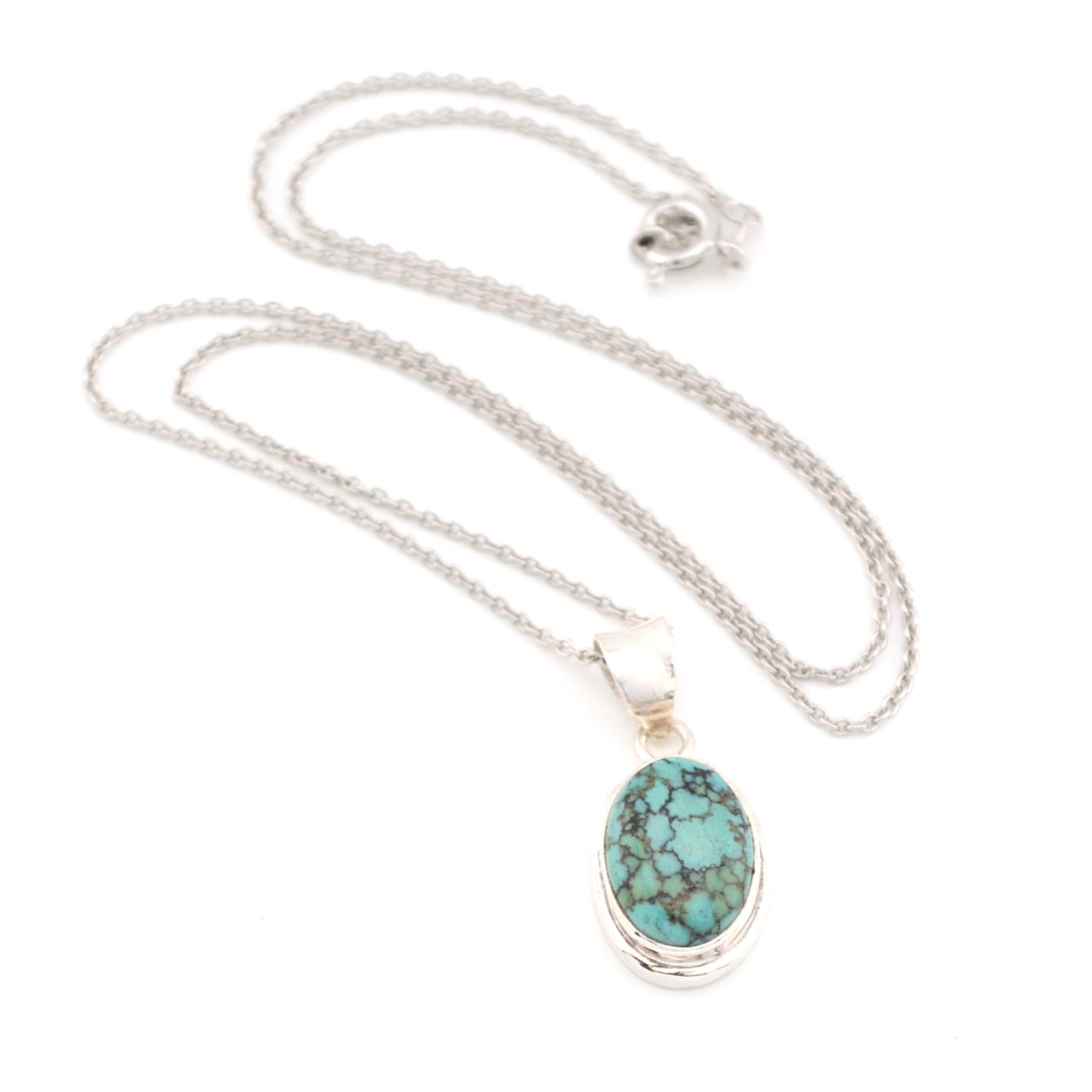 Turquoise pendant necklace on a white background