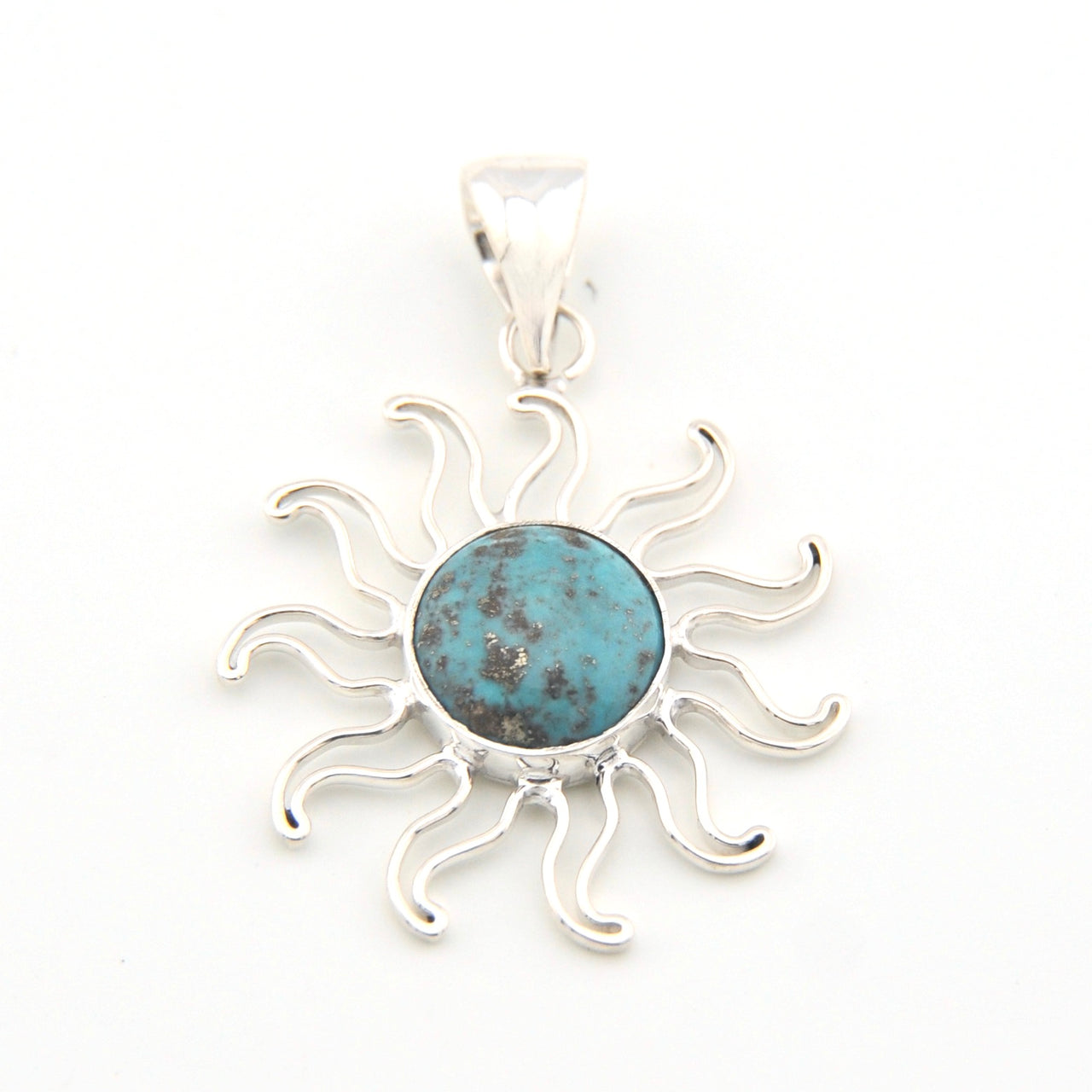 Silver sun-shaped pendant with a blue center on a white background