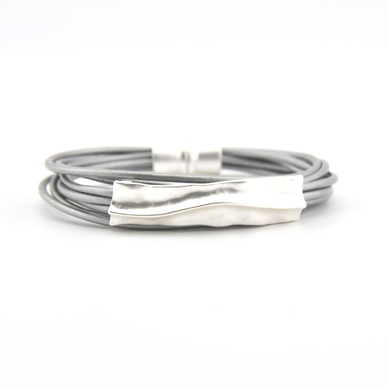 Silver bracelet with a textured clasp on a white background