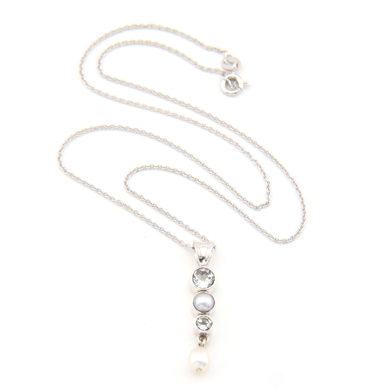 Necklace with a pendant featuring pearls and topaz on a white background
