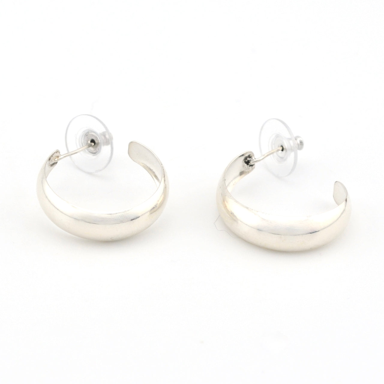 Pair of silver hoop earrings on a white background