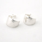Pair of silver hoop earrings on a white background