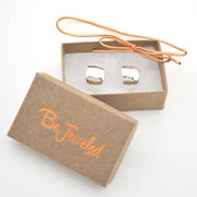 Silver hoops in a 'Be Jeweled' box on a white background