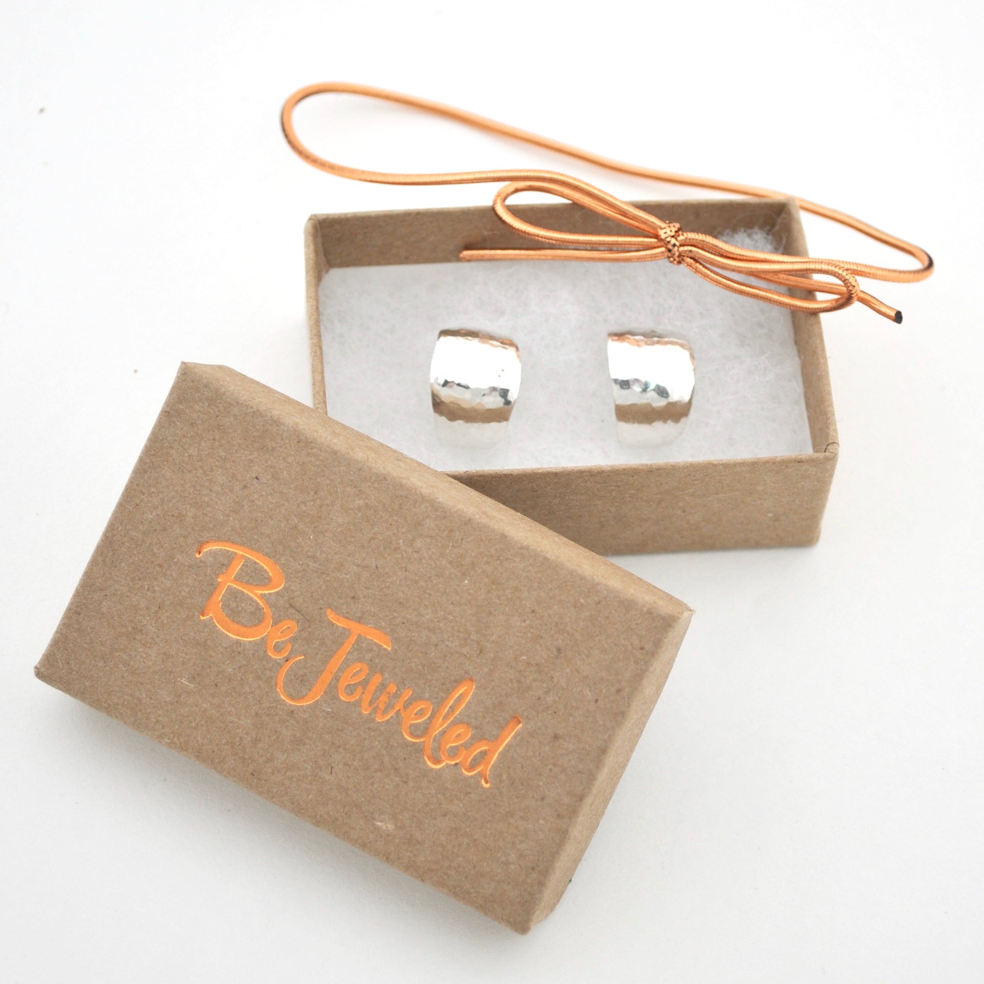 Silver hoops in a 'Be Jeweled' box on a white background