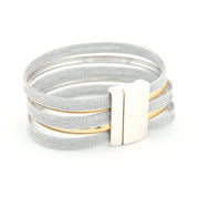 Multistrand bracelet with a gold and silver clasp on a white background