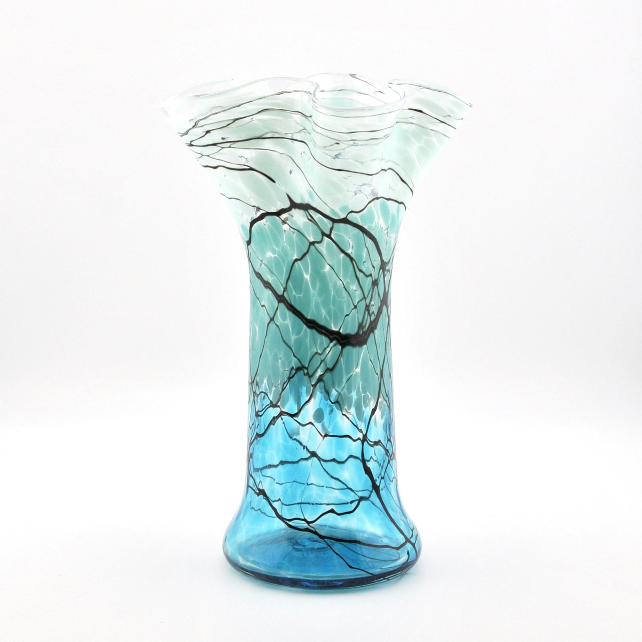 Glass vase with blue and black pattern on a white background
