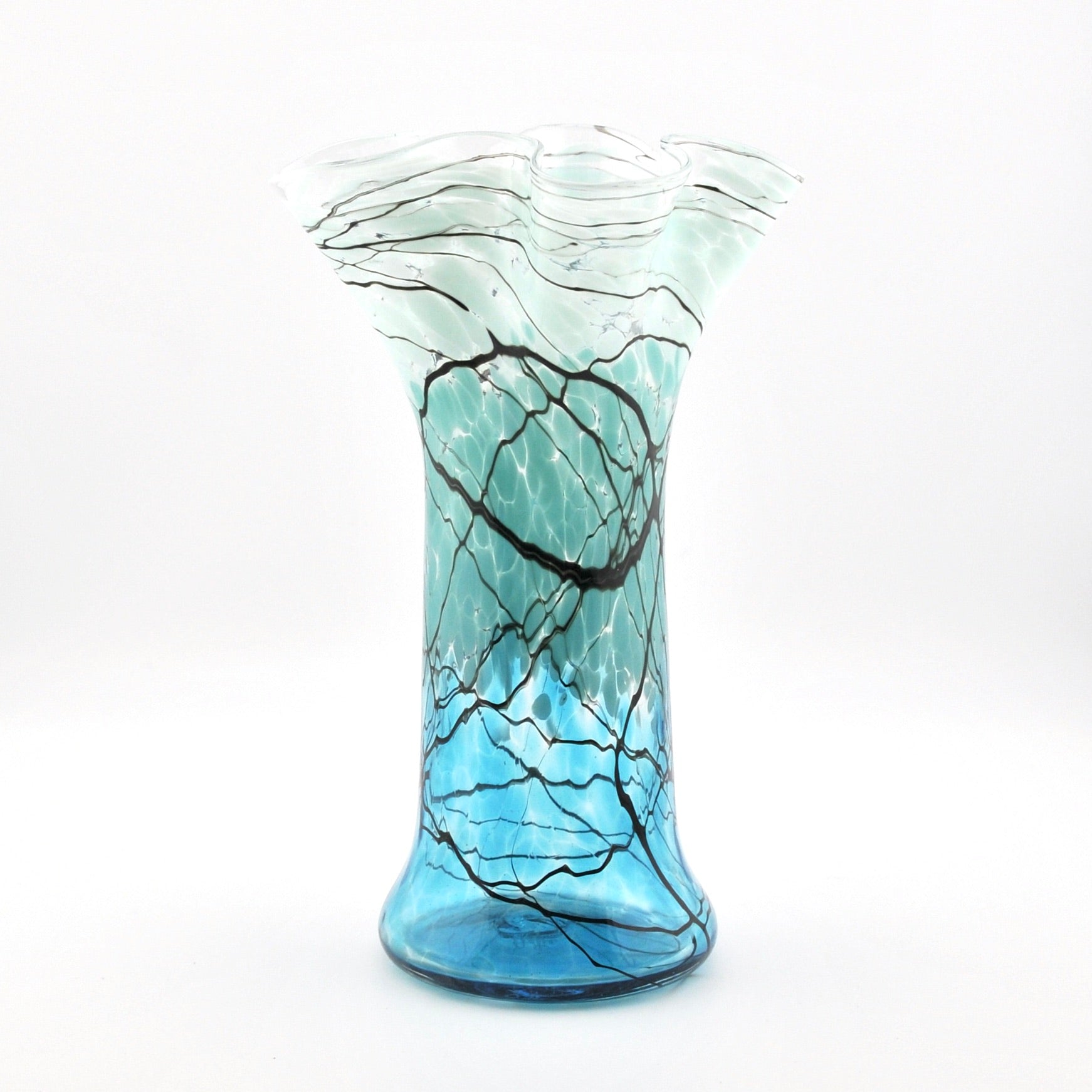 Glass vase with blue and black pattern on a white background