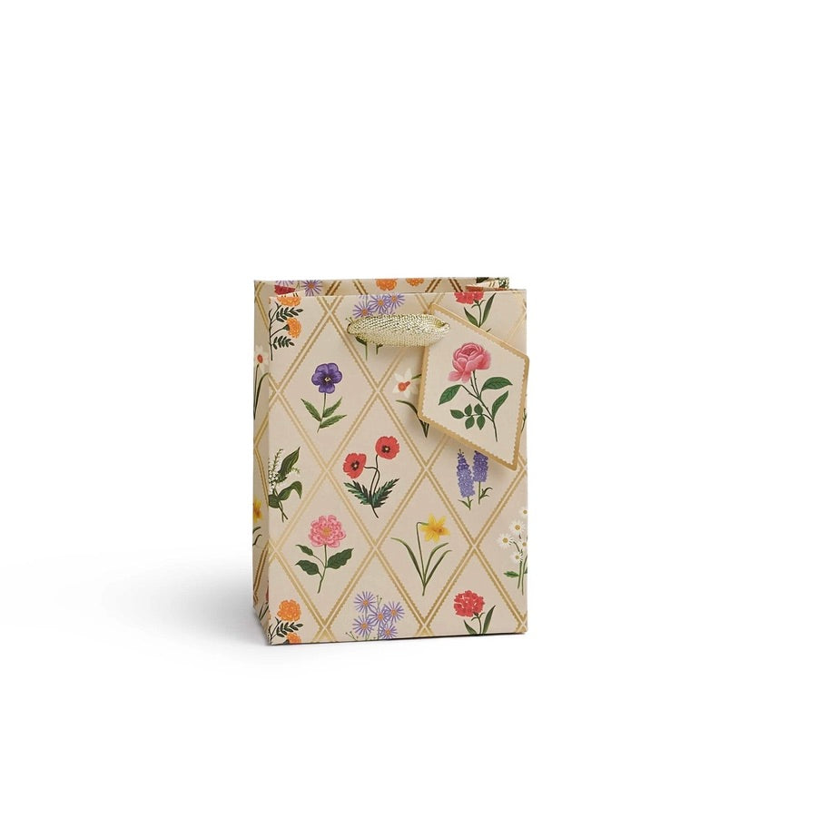 Gift box with floral design and bow on a white background