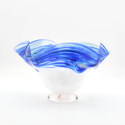 Glass bowl with blue and clear design on a white background