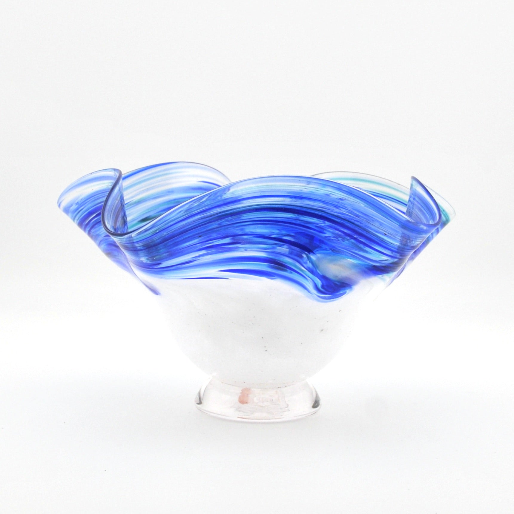 Glass bowl with blue and clear design on a white background