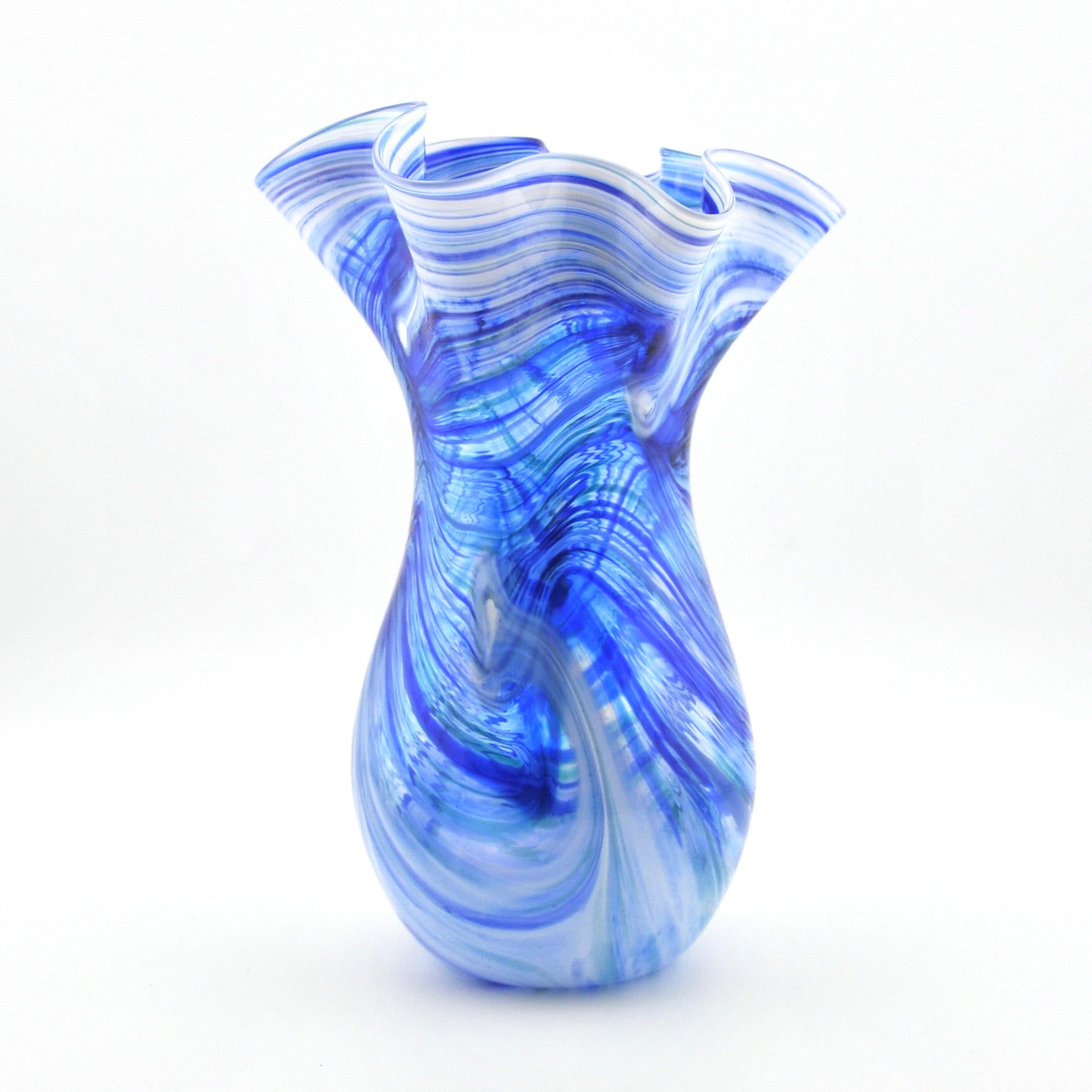 Blue and white swirled glass vase on a white background