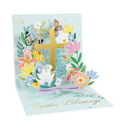 Easter-themed pop-up card with cross, flowers, and butterflies on a light blue background.