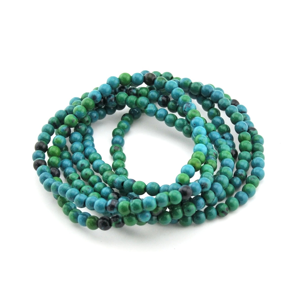 Multistrand beaded bracelet with green and blue beads on a white background