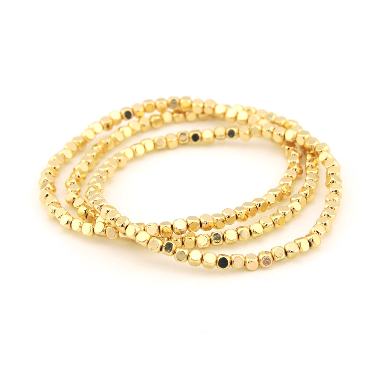 Two gold beaded bracelets on a white background
