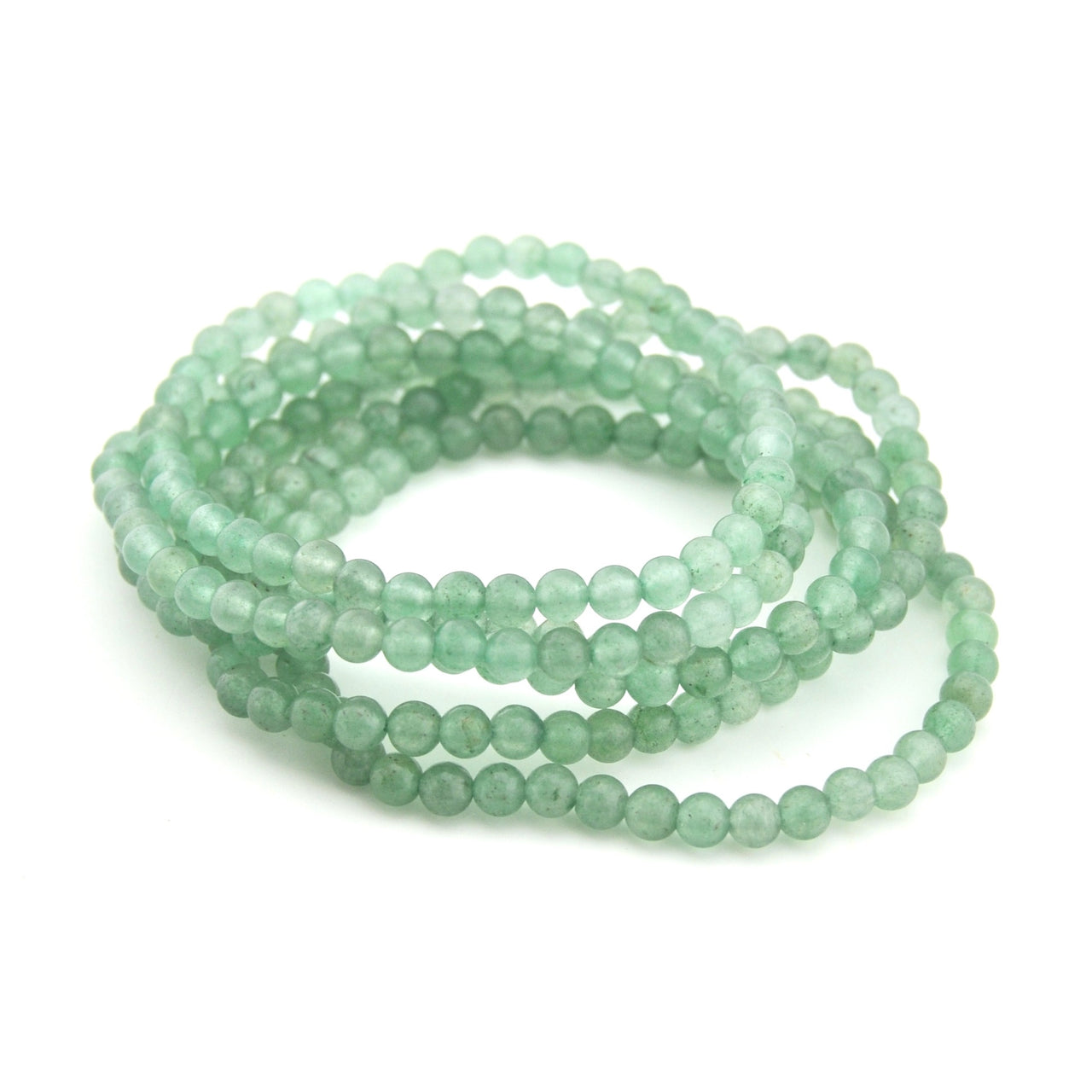 Stack of light green beaded bracelets on a white background