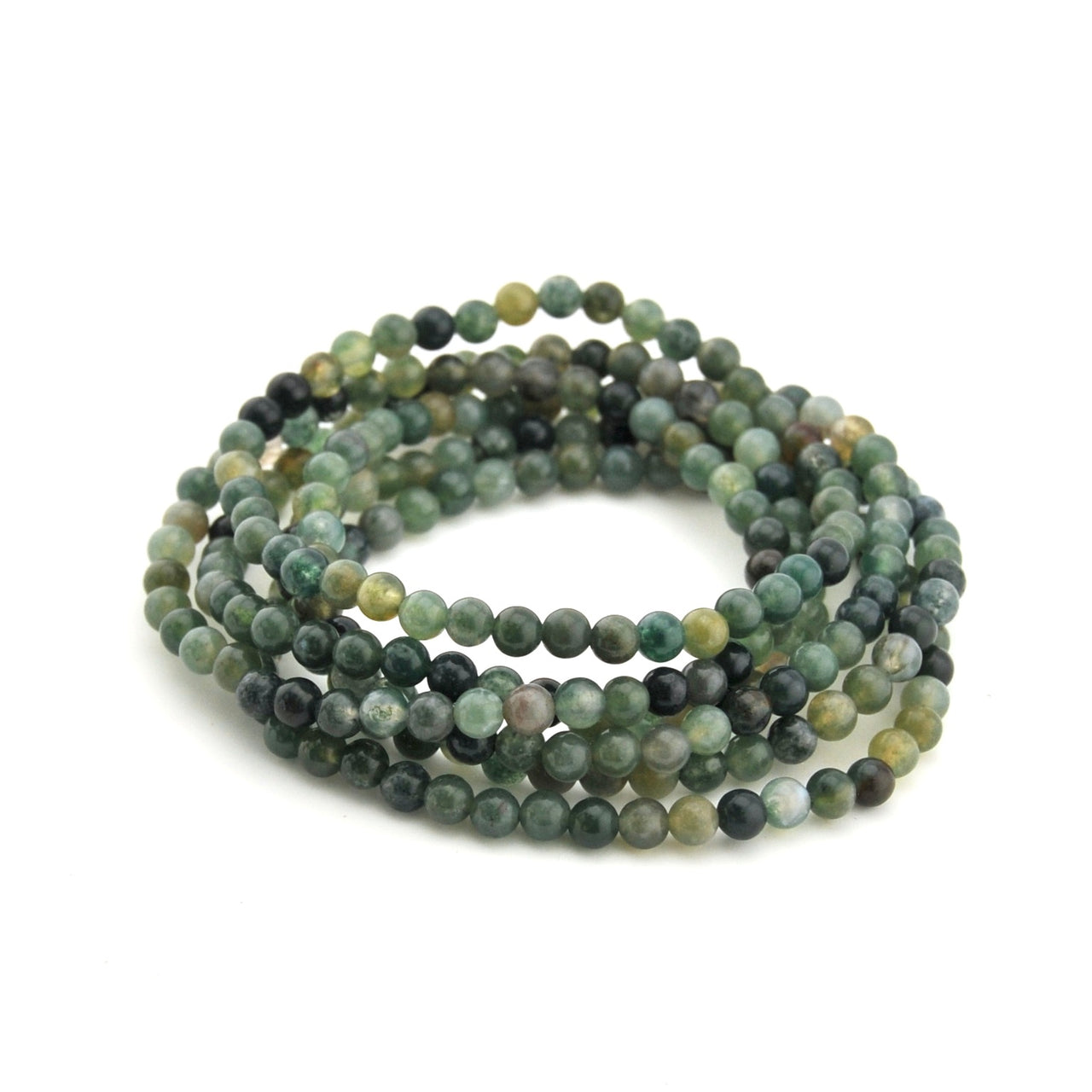 Stack of multicolored beaded bracelets on a white background