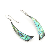 A pair of silver dangle earrings featuring curved, fan-shaped abalone shell inlays with iridescent green, blue, and purple patterns, shown on a plain white background.