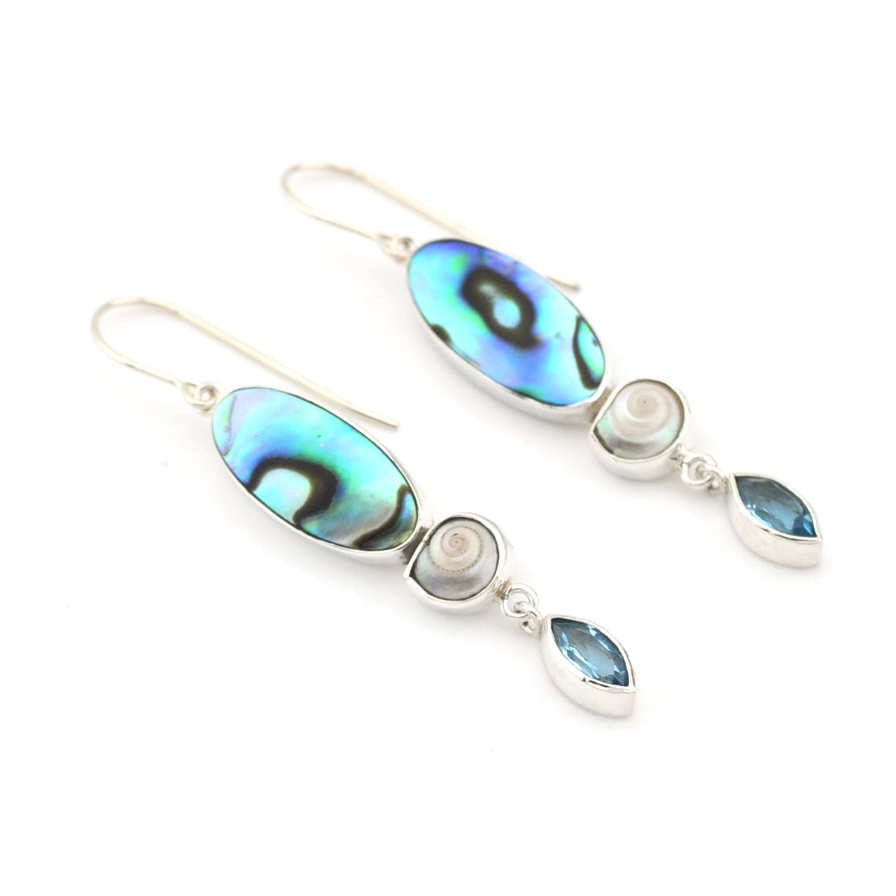 Pair of earrings with abalone shell and pearl elements on a white background