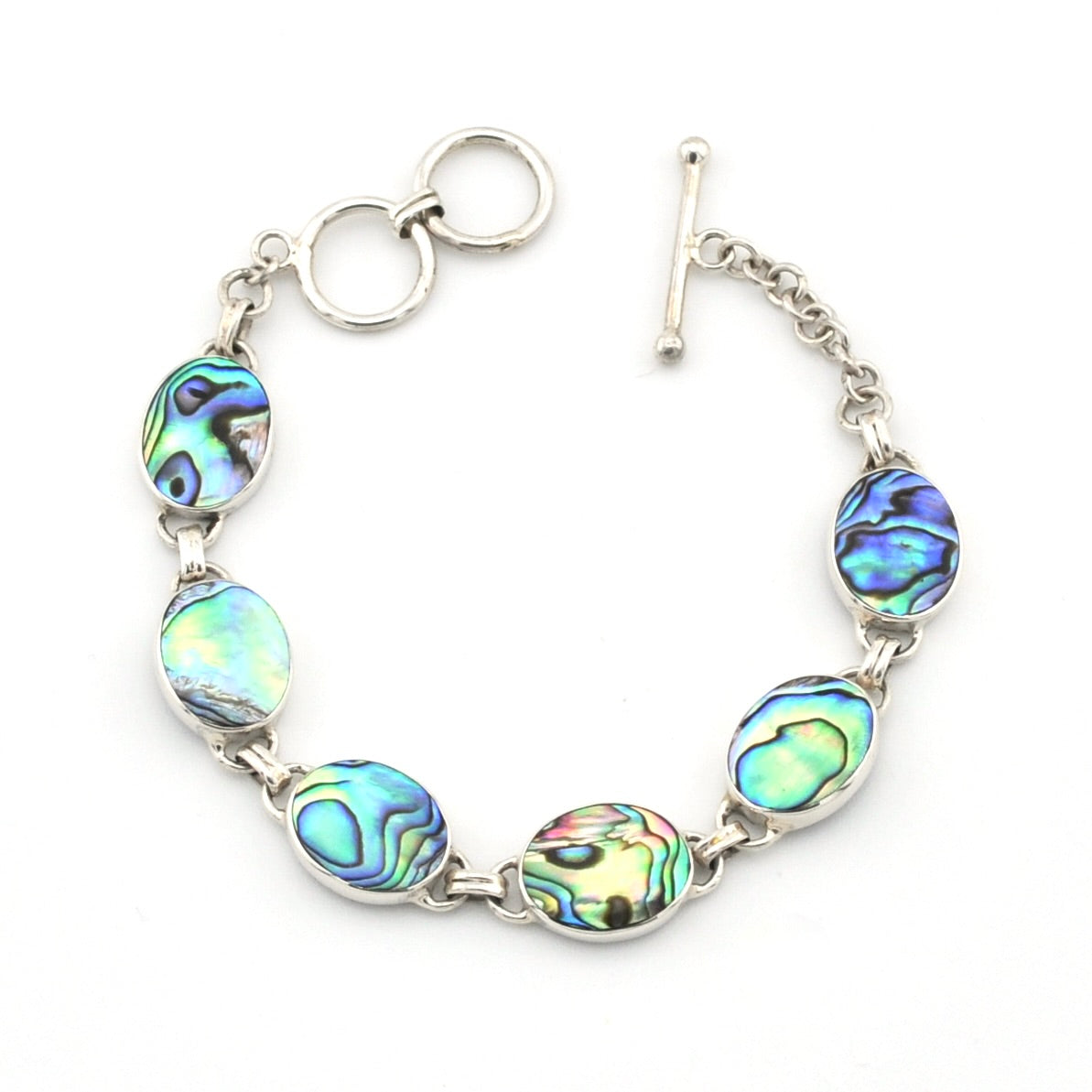 A silver-toned bracelet featuring five oval abalone shell beads with iridescent blue, green, and gold patterns, shown on a plain white background.