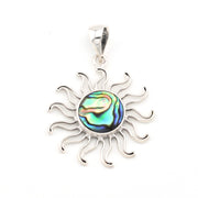 Sun-shaped pendant with abalone shell center on a white background