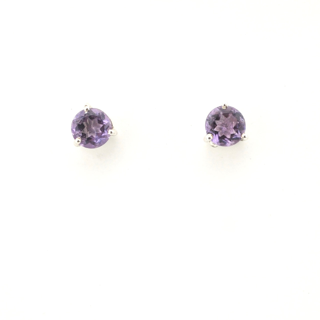 Pair of round purple gemstone earrings on a white background