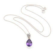 A silver teardrop pendant necklace with a faceted purple gemstone, displayed on a clean white background.