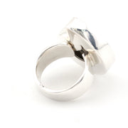 A polished silver ring, shown on a seamless white background.