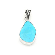 A silver teardrop pendant featuring a smooth, light blue turquoise stone in a polished bezel setting, with a textured silver bail at the top, shown against a plain white background.