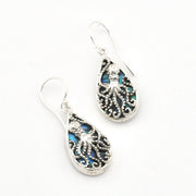 A pair of silver teardrop dangle earrings featuring intricate filigree octopus designs and iridescent blue-green abalone shell inlays, set against a plain white background.