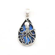 Tear shaped pendant with an octopus design and blue abalone.