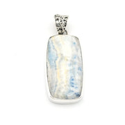 A rectangular silver pendant featuring a natural Larimar stone with blue and white marbled patterns, set in a polished silver bezel with a decorative silver bail.