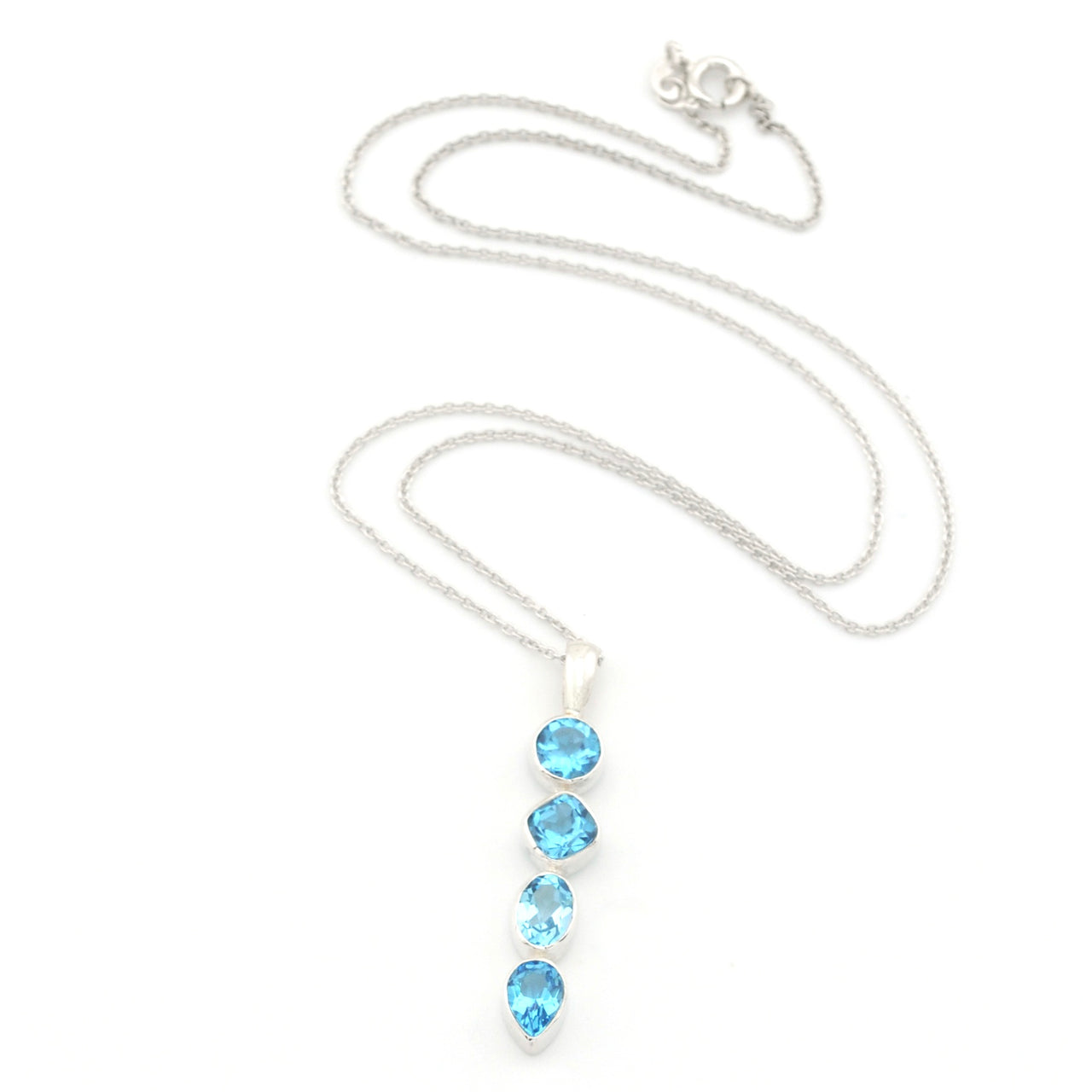 A silver chain necklace featuring a vertical drop pendant with four light blue gemstones in bezel settings, displayed on a clean white background.