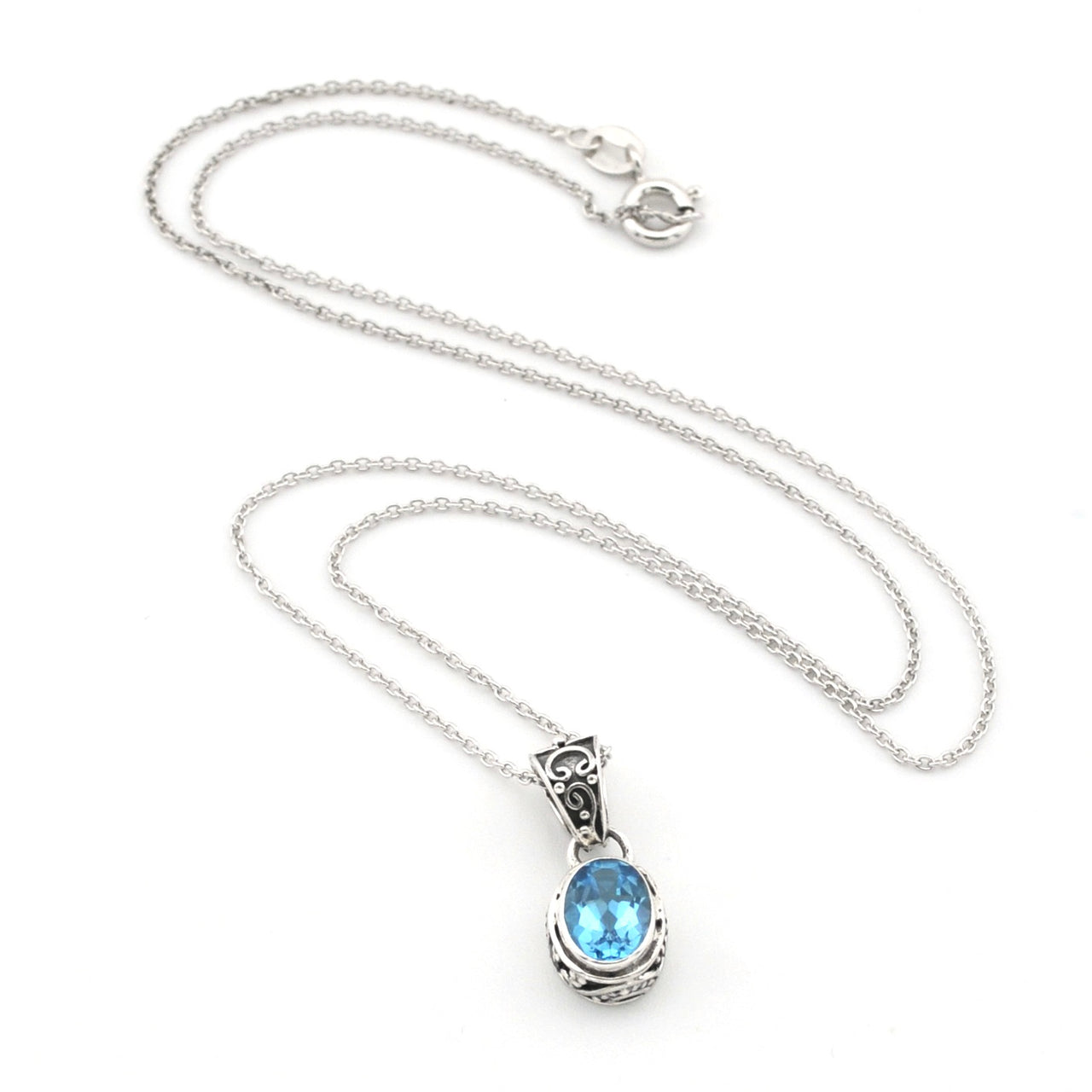 A silver chain necklace with a teardrop-shaped pendant featuring a light blue gemstone in a silver bezel setting, displayed on a clean white background.