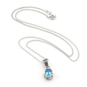 A silver chain necklace with a teardrop-shaped pendant featuring a light blue gemstone in a silver bezel setting, displayed on a clean white background.