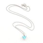 A silver chain necklace with a small trillion-shaped light blue gemstone pendant, displayed on a clean white background.