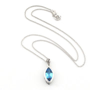 A silver-tone chain necklace with a marquise-cut light blue gemstone pendant in a silver bezel setting, displayed on a clean white background.