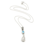 A silver pendant necklace featuring a teardrop-shaped white moonstone drop and a small rectangular light blue gemstone, displayed on a clean white background.