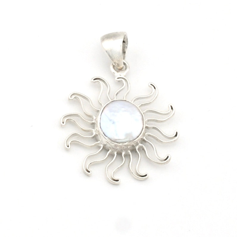 Silver sun-shaped pendant with a central gemstone on a white background