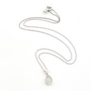 A silver chain necklace with a teardrop-shaped white opal pendant, displayed on a clean white background.