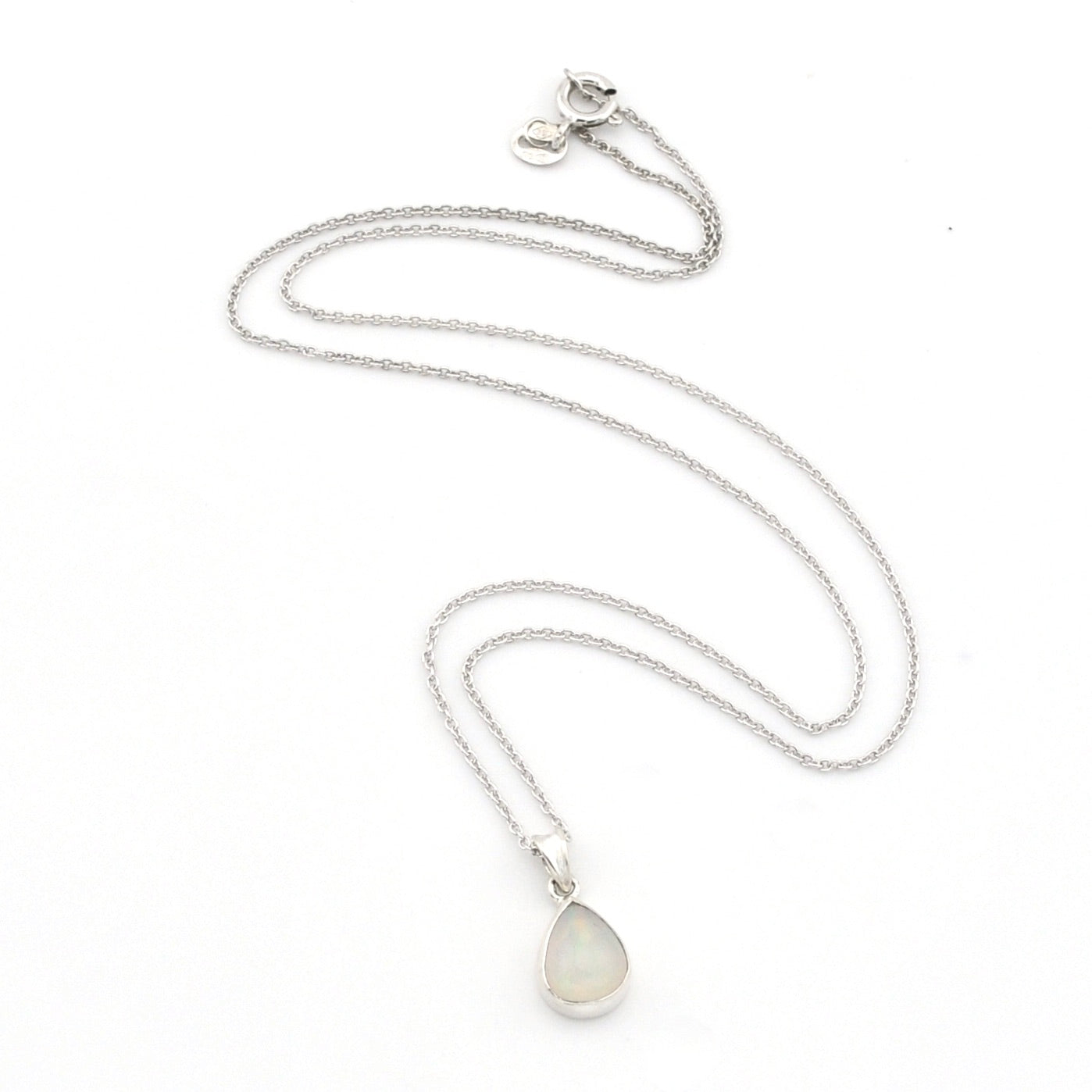 A silver chain necklace with a teardrop-shaped white opal pendant, displayed on a clean white background.