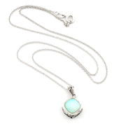A silver chain necklace with a square pendant featuring a light blue-green opal-like stone in a silver bezel setting, displayed on a clean white background.