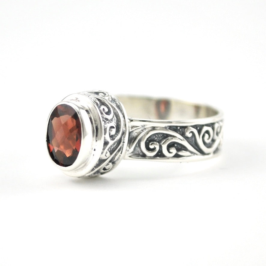 Sterling Silver Garnet 5x7mm Oval Swirl Band Ring
