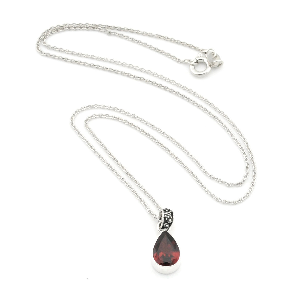 A silver chain necklace with a teardrop-shaped dark red gemstone pendant, displayed on a clean white background.