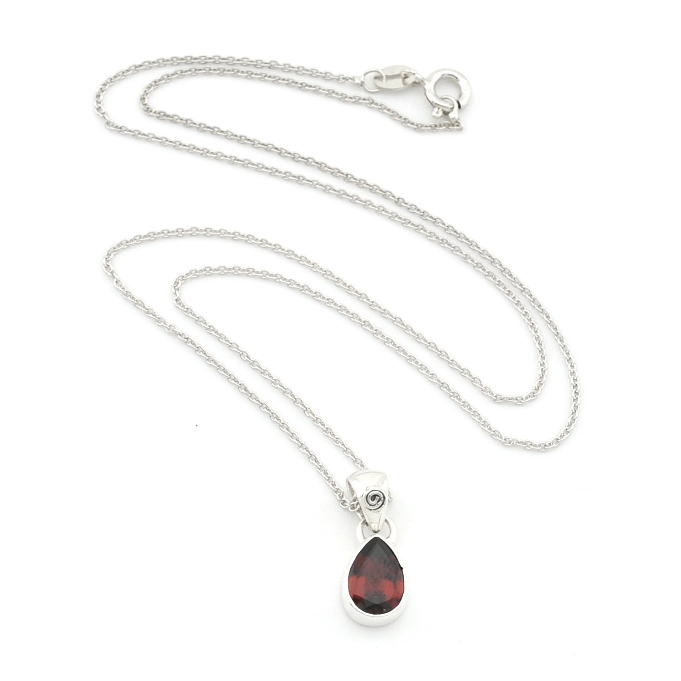 A silver chain necklace with a teardrop-shaped dark red gemstone pendant, displayed on a clean white background.